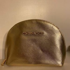 Gold Michael Kors makeup bag